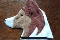 Soft, microfiber terry cloth towels cut, sewn, and made in the shape of a dog