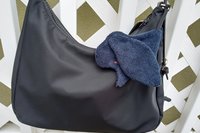 Smudge dog attached to a handbag always within reach.