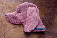 Soft, microfiber terry cloth towels cut, sewn, and made in the shape of a dog
