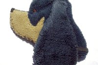 Soft, microfiber terry cloth towels cut, sewn, and made in the shape of a dog