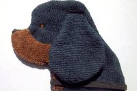 Soft, microfiber terry cloth towels cut, sewn, and made in the shape of a dog