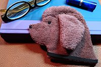Brown Newfoundland towel waiting to be used as a bookmark 