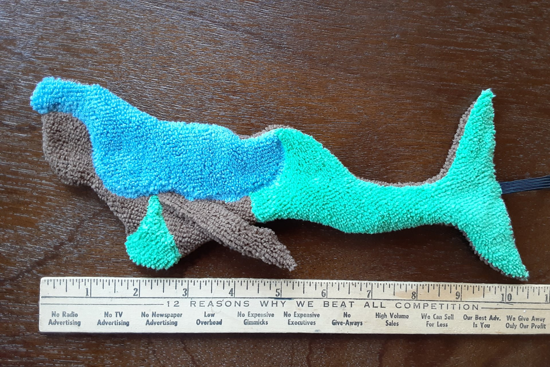 Brown mermaid with blue hair