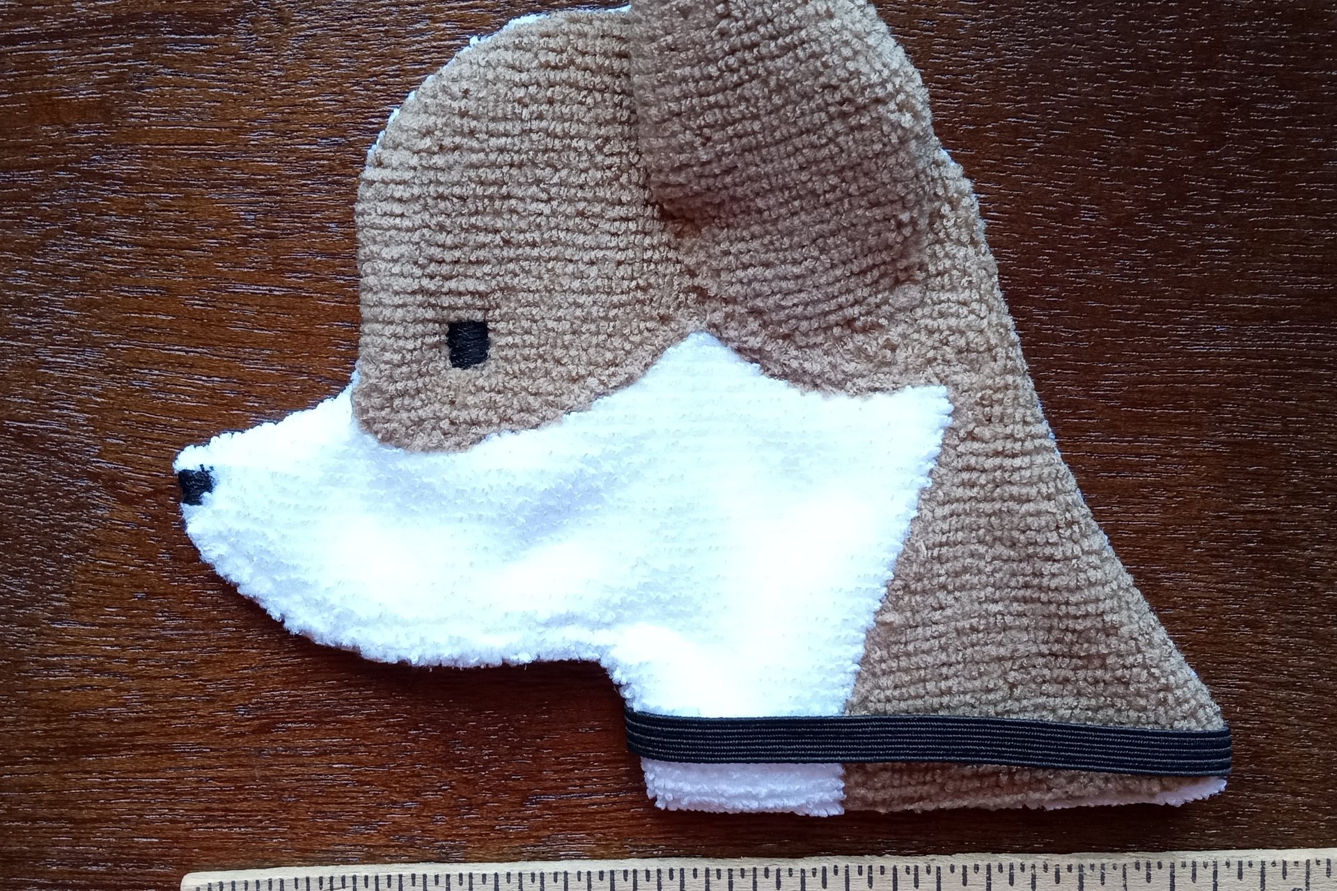 Smudge Dog with ruler to show size.