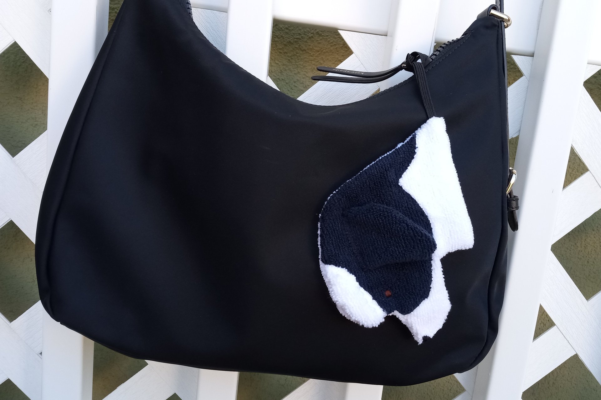 Smudge dog attached to a handbag always within reach.