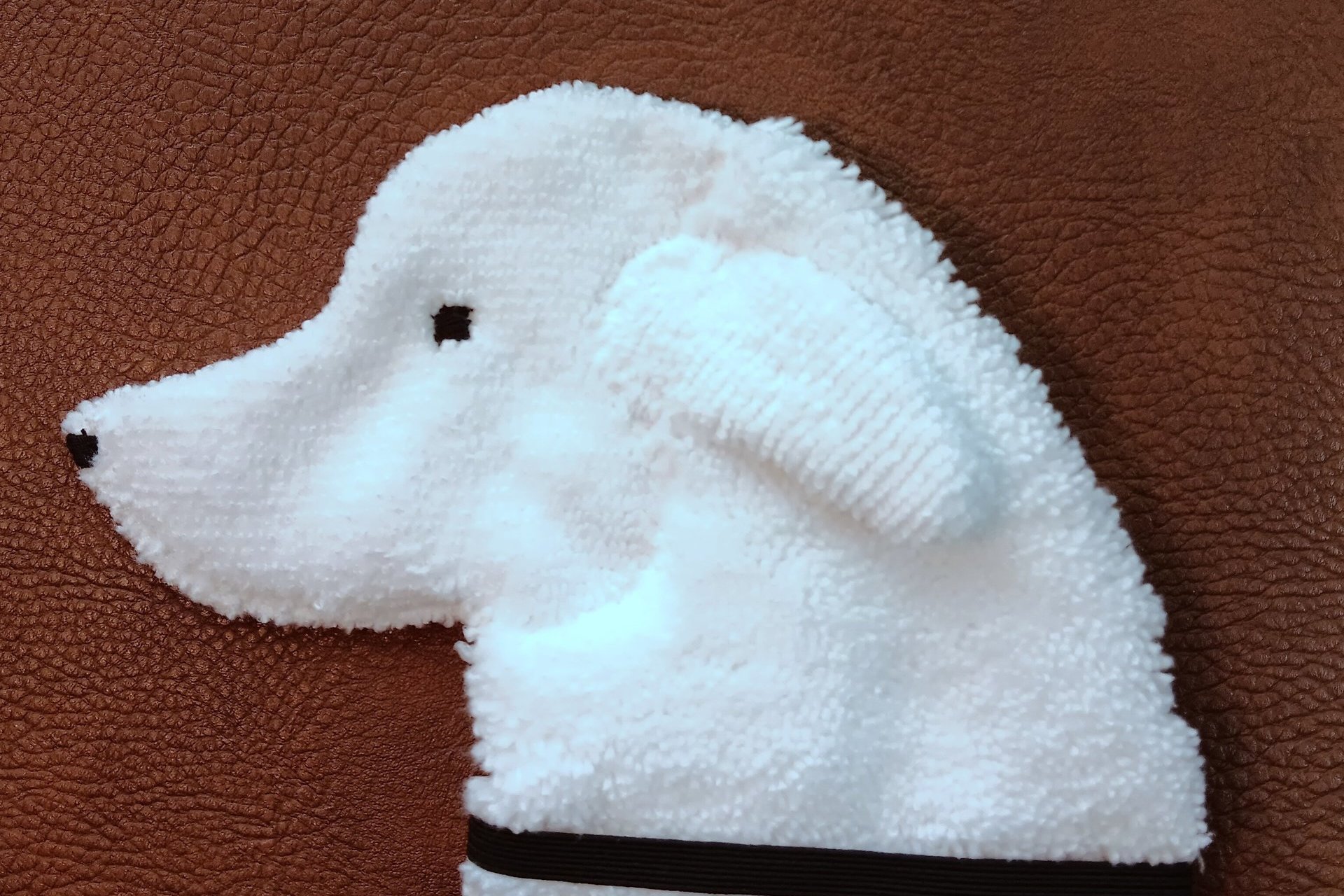 Soft, microfiber terry cloth towels cut, sewn, and made in the shape of the head of an Akbash. Little larger than palm sized. Texture of the Smudge Dog is perfect for cleaning cell phone screens, musical instruments, glasses, etc.