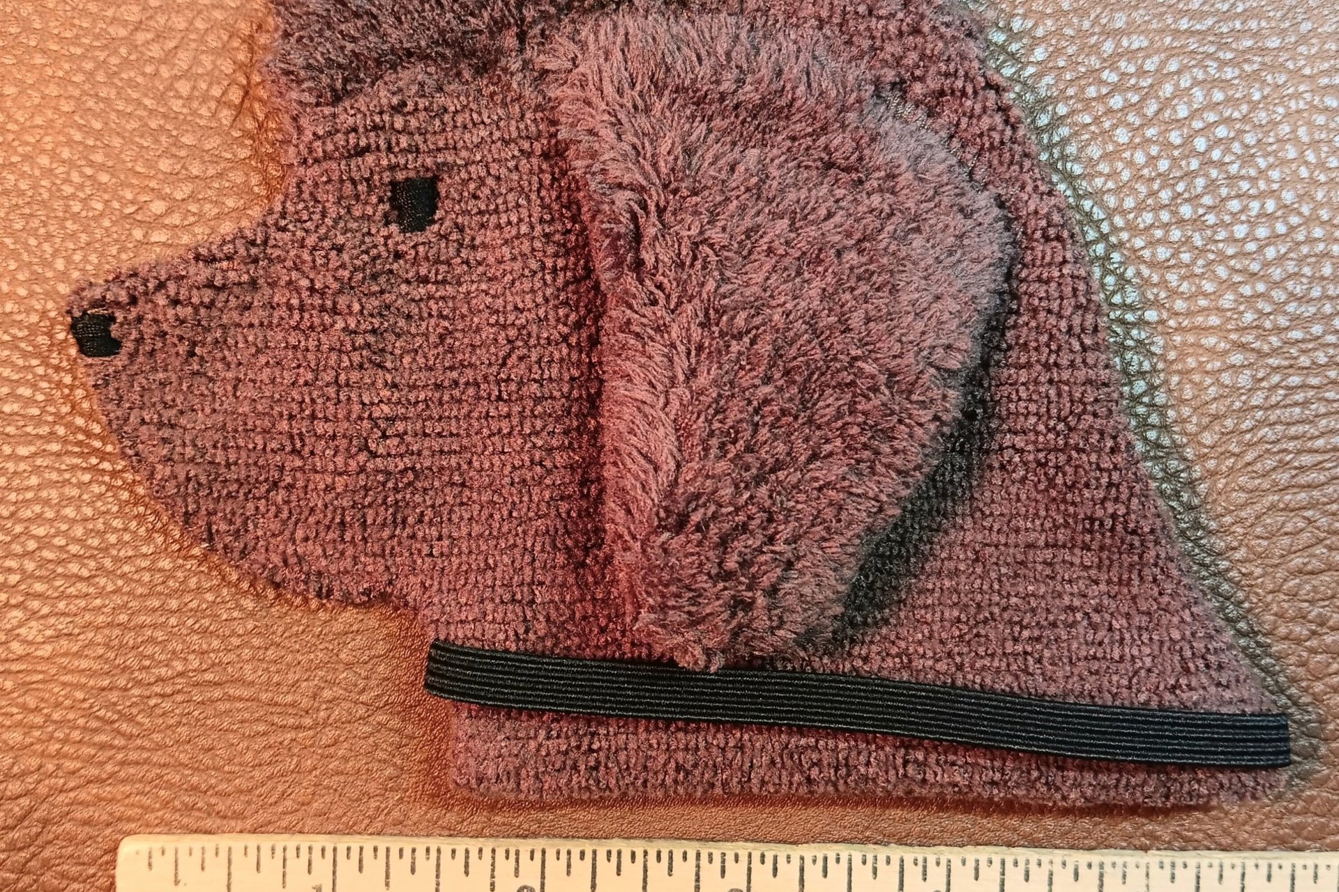 Smudge Dog shown with ruler to illustrate size
