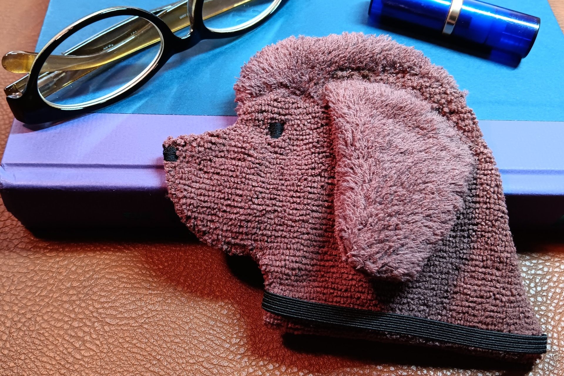 Brown Newfoundland towel waiting to be used as a bookmark 