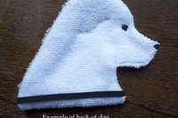 The backside of the dog. Solid white fabric.