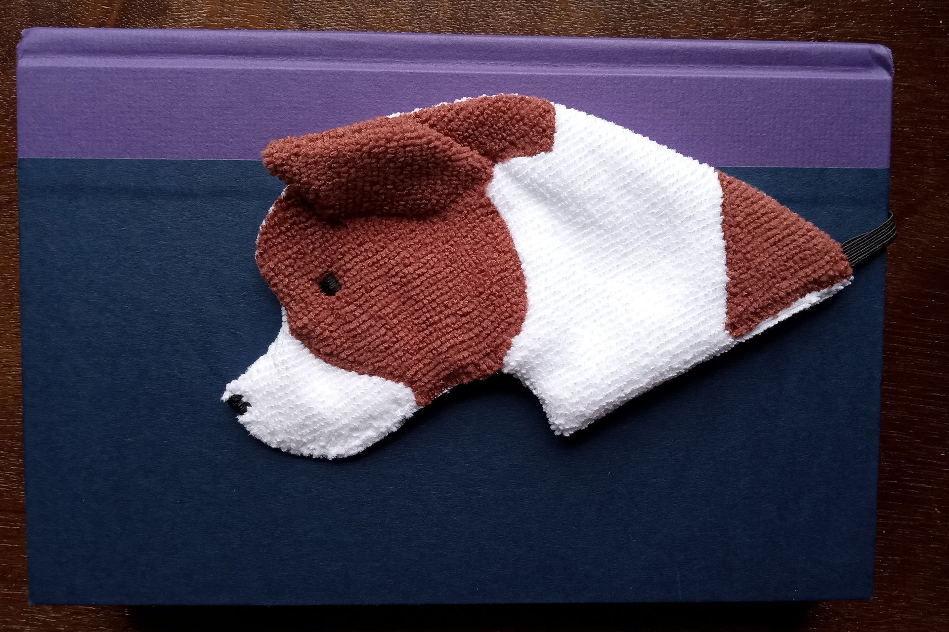Smudge Dog being used as a bookmark.