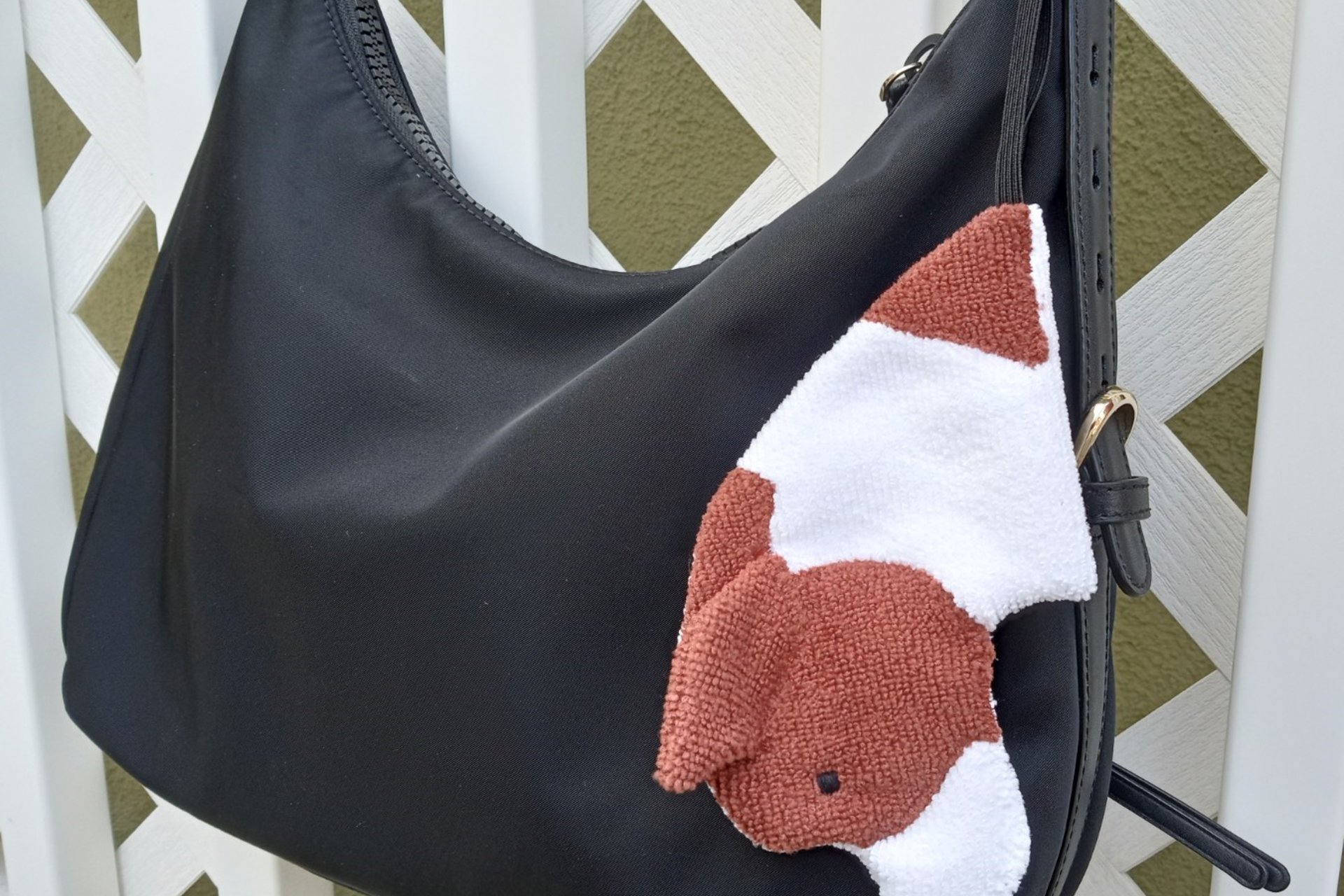 Smudge dog looped to a purse for easy access.